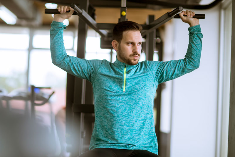 A serious man at the gym thinking.